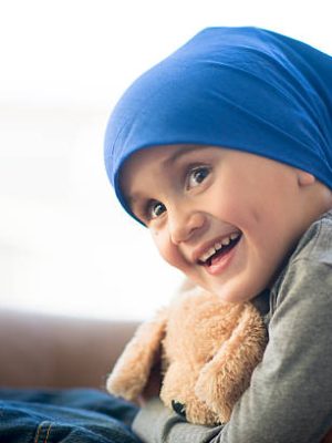 Little boy and his teddy bear after a chemotherapy treatment Little boy and his teddy bear after a chemotherapy treatment
